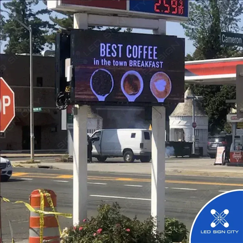 Roadside LED sign advertising coffee at a fuel station
